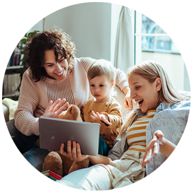 A young couple with a child looking at a tablet device